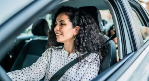 Woman driving her family in a car