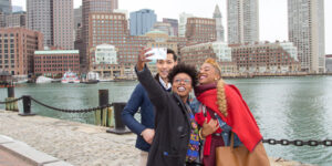 Three people taking a photo in Boston, Massachusetts