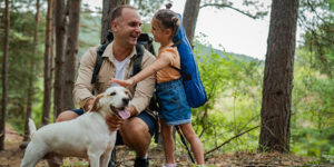 A father and daughter enjoying the New Hampshire woods